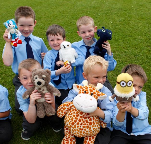 Infants and their teddies enjoy a picnic